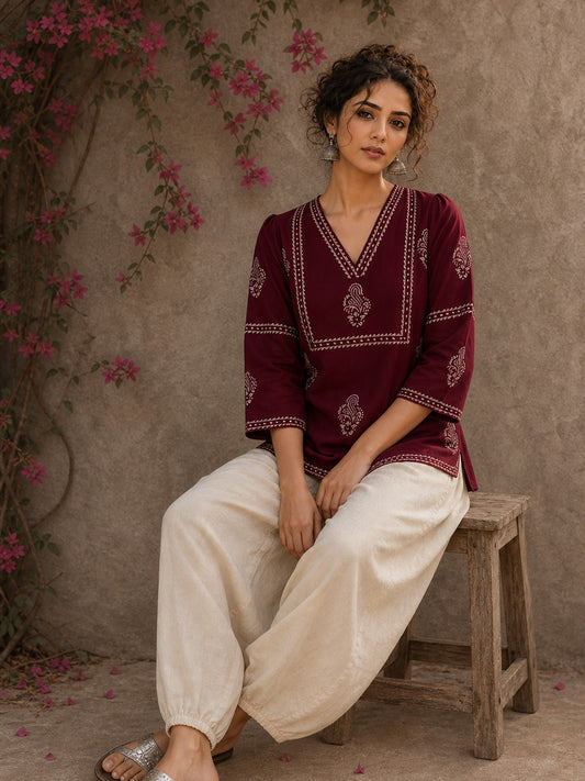 Graceful maroon hand block print top featuring timeless paisley motifs, delicate borders, and an elegant V-neck silhouette, crafted for effortless everyday sophistication.