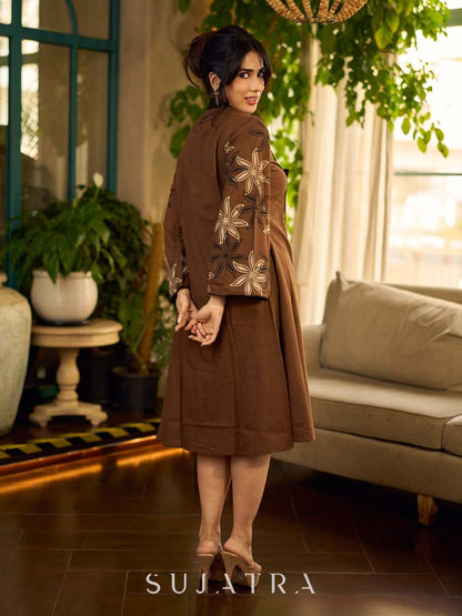 Brown block print dress with floral block printed flared sleeves, black tie-up neckline, and contrast black accents for an effortless, elegant everyday look.