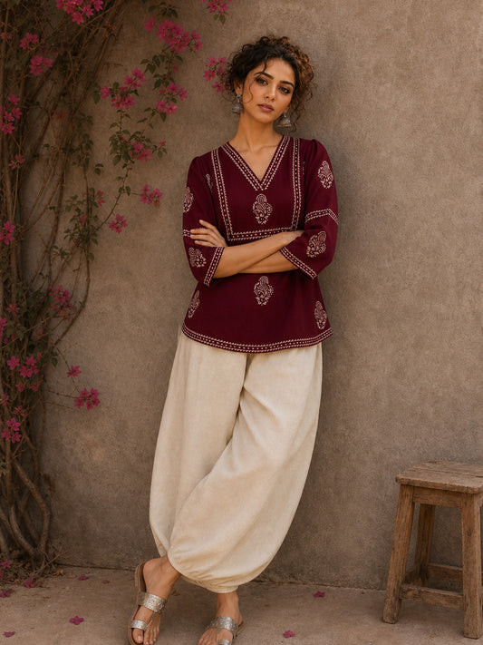 Graceful maroon hand block print top featuring timeless paisley motifs, delicate borders, and an elegant V-neck silhouette, crafted for effortless everyday sophistication.