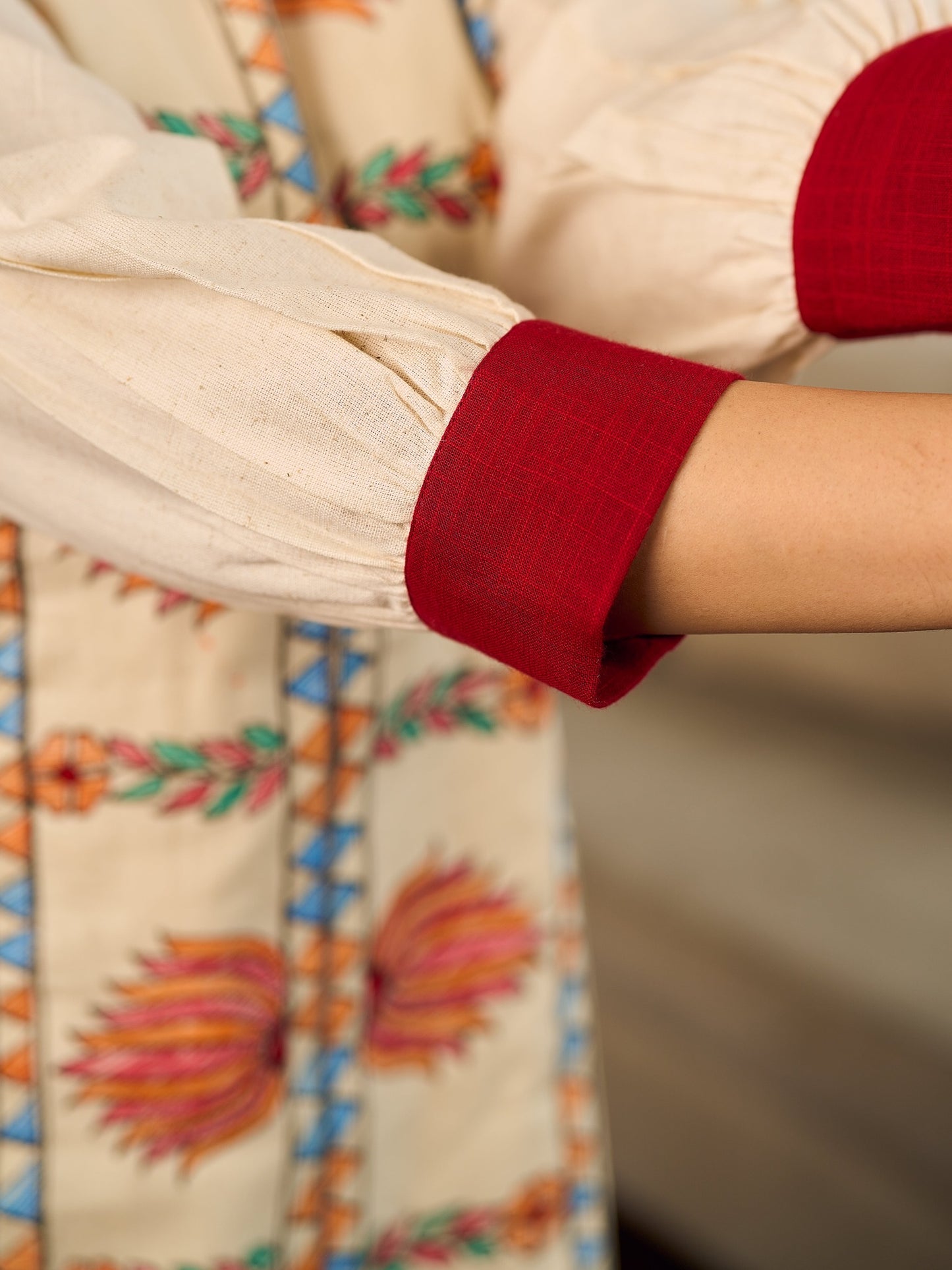 Artisan-crafted off-white Madhubani dress with beautiful hand-painted motifs and trim.