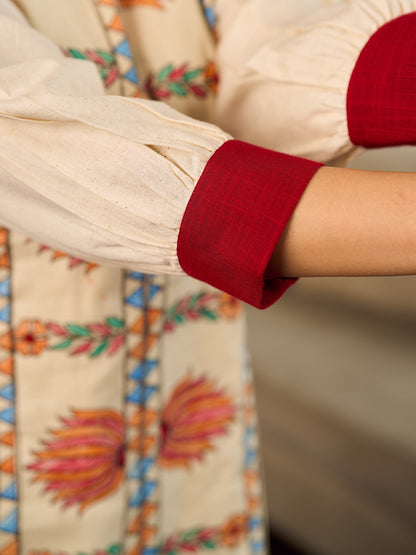 Artisan-crafted off-white Madhubani dress with beautiful hand-painted motifs and trim.