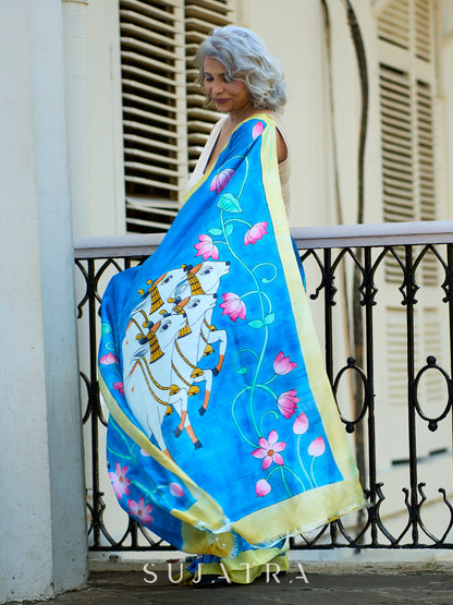 Vibrant Blue Silk Saree with Pichwai Motifs and Floral Border