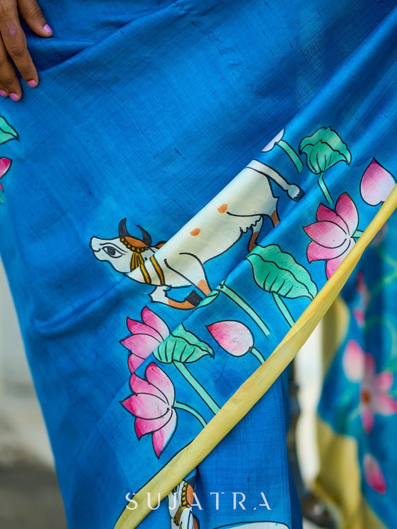 Vibrant Blue Silk Saree with Pichwai Motifs and Floral Border