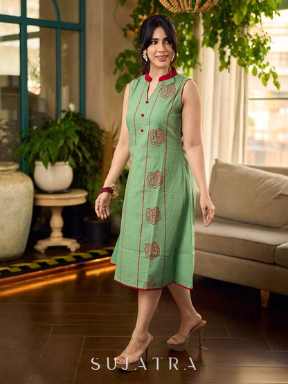 Pista sleeveless block printed dress with red abstract motif panels, a contrasting red collar, and accents for a fresh, artisanal, contemporary look.