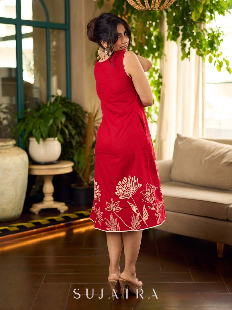Vibrant red sleeveless dress with a bold off-white floral hand block print at the hem and clean off-white edging for a striking, handcrafted-inspired finish.