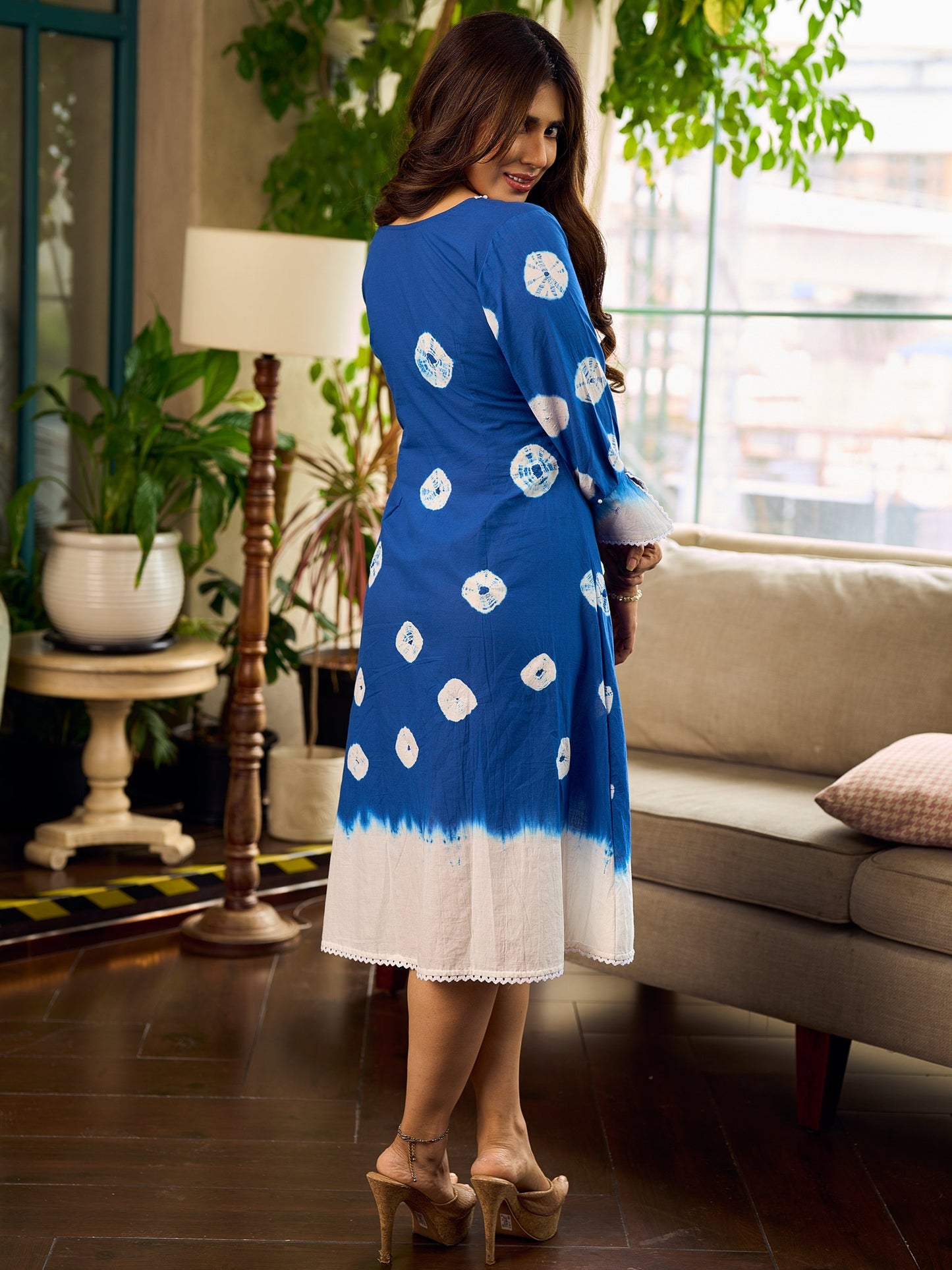 Refreshing cobalt blue shibori tie-dye dress with ivory accents and delicate lace-trimmed neckline.