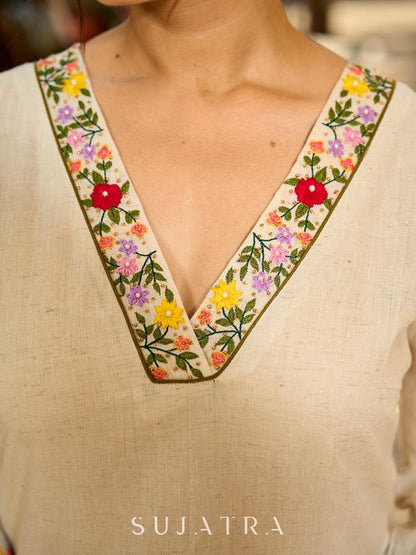Classic Off-White Straight Cotton Kurta Featuring Vibrant Floral Hand Embroidery on Neckline & Sleeve Cuffs
