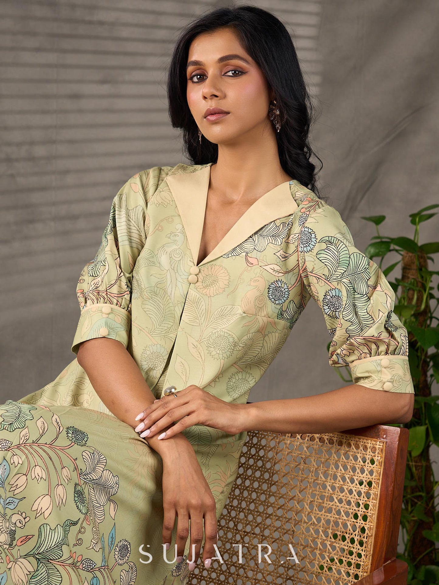 Soft green Kalamkari printed collared dress with centre pleat detailing.