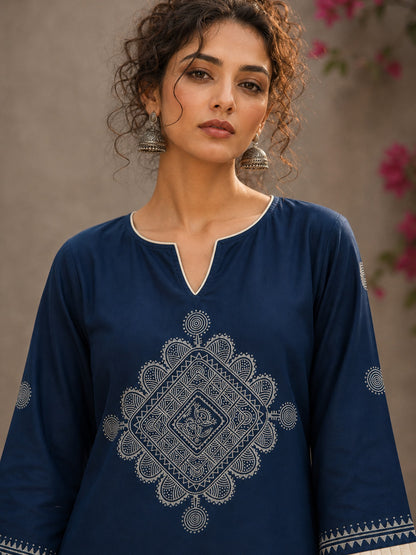 Captivating navy top adorned with a bold, rhythmic block print design, pleated sleeve detailing, and a versatile cut.