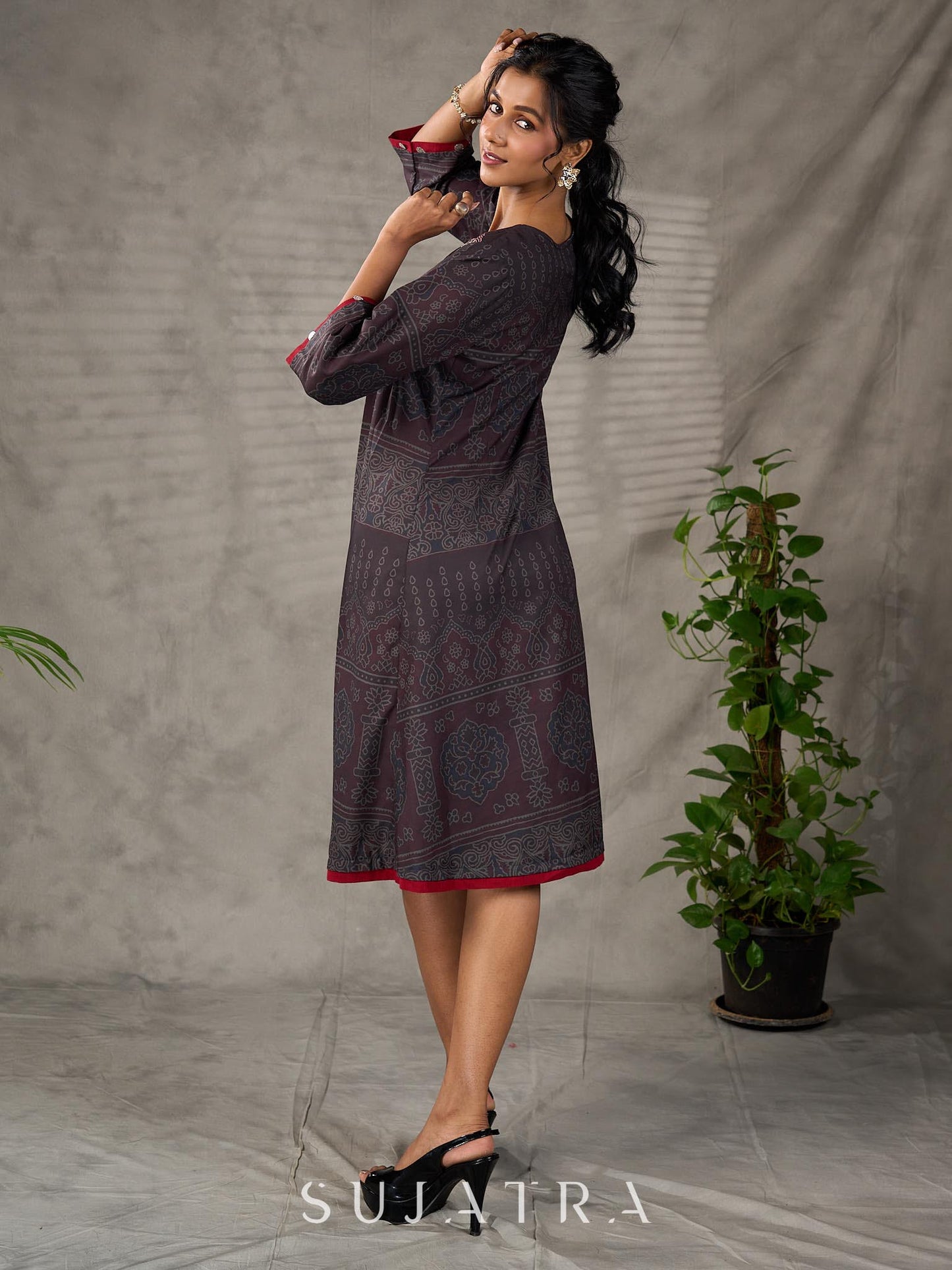 Black Ajrakh printed dress with pleats, maroon accents, and silver embellishments.