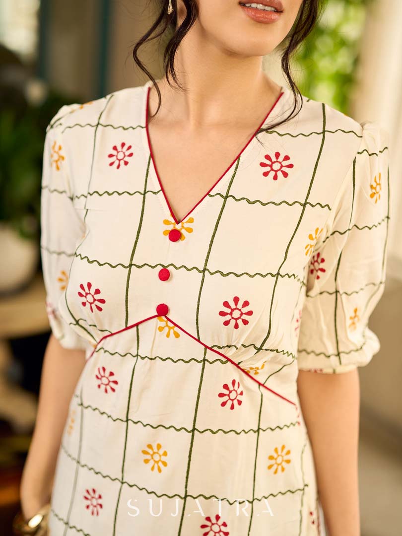 Soft off-white block printed rayon dress with intricate all-over hand block printed checks and florals, a gently gathered yoke, and rich red accents for a refined, elegant everyday look.