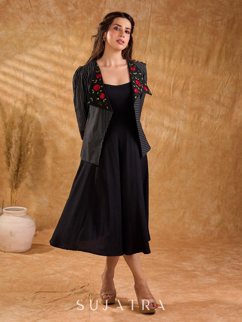 Exquisite black Ikat jacket with offset collar flaps and detailed red floral vine embroidery, delivering a sculpted, high-impact silhouette with refined presence for corporate styling.