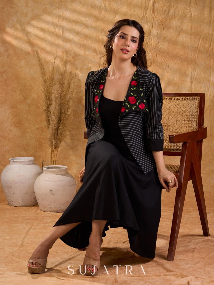 Exquisite black Ikat jacket with offset collar flaps and detailed red floral vine embroidery, delivering a sculpted, high-impact silhouette with refined presence for corporate styling.