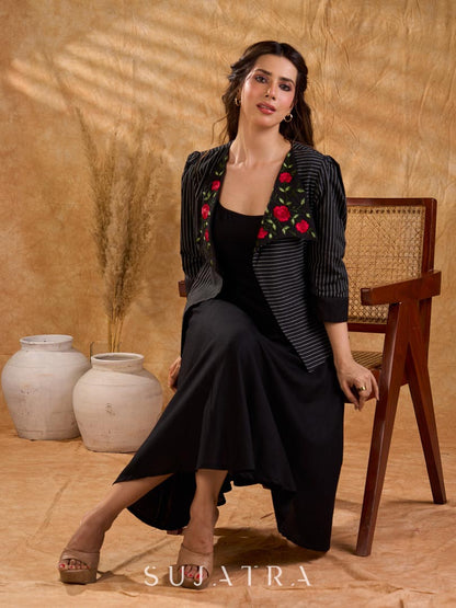 Exquisite black Ikat jacket with offset collar flaps and detailed red floral vine embroidery, delivering a sculpted, high-impact silhouette with refined presence for corporate styling.