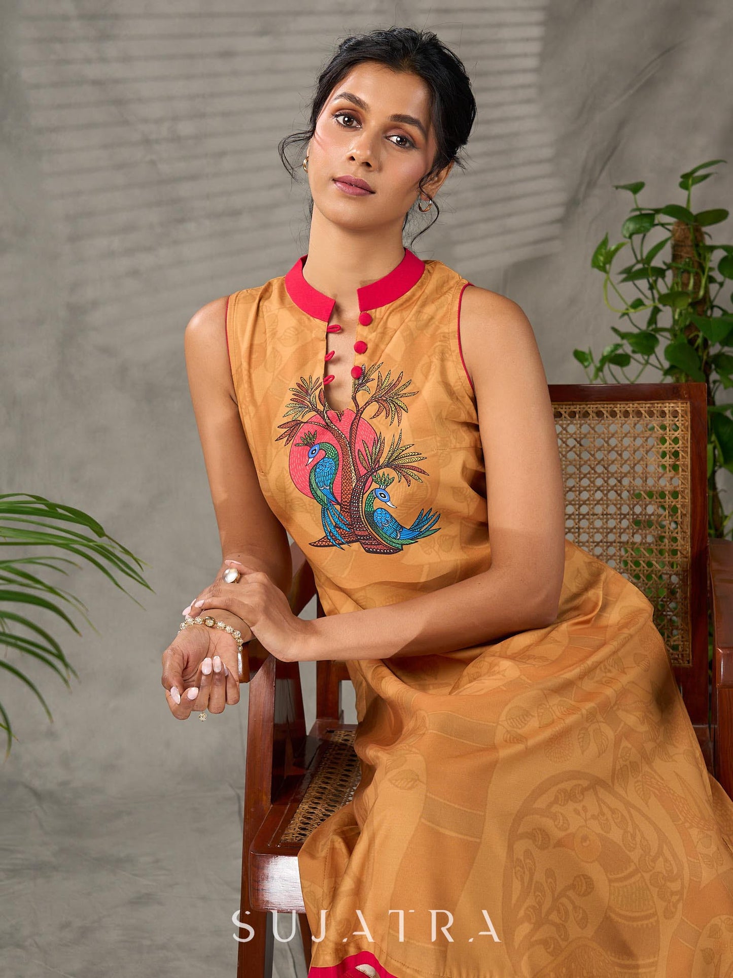 Mustard Gond printed mandarin collar dress with vibrant pink accents.