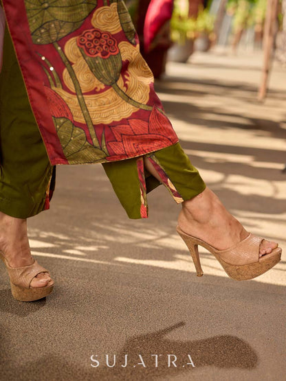 Classic deep rustic maroon kurta with detailed hand embroidery, statement olive and cream Pichwai artwork, and rich gold highlights