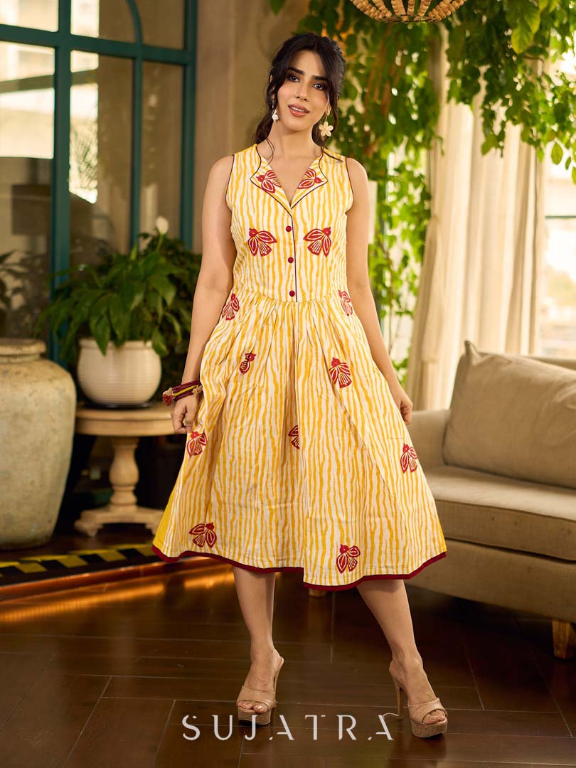 Yellow and white zebra-striped hand block printed sleeveless vintage luxe dress with maroon bird motifs and matching accents for a bold, elegant statement look.