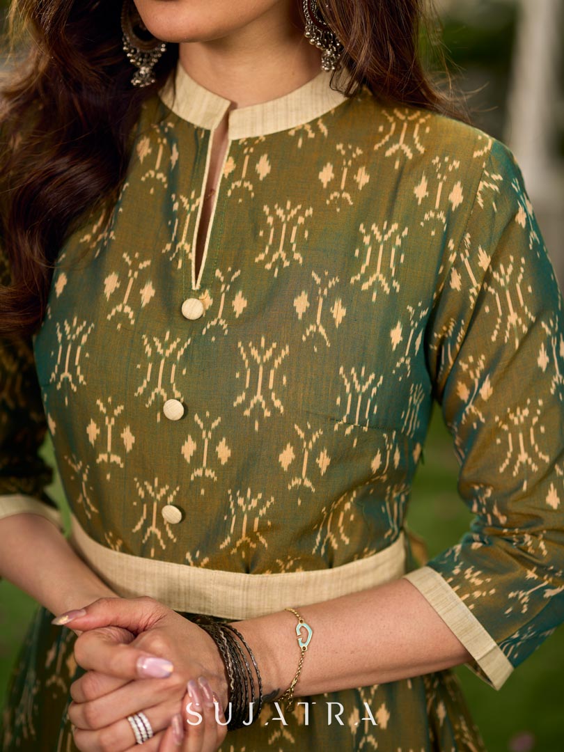 Statement olive green two-tone Ikat dress elevated with cream and gold accents, a structured belt for definition, and a subtle left-front slit.