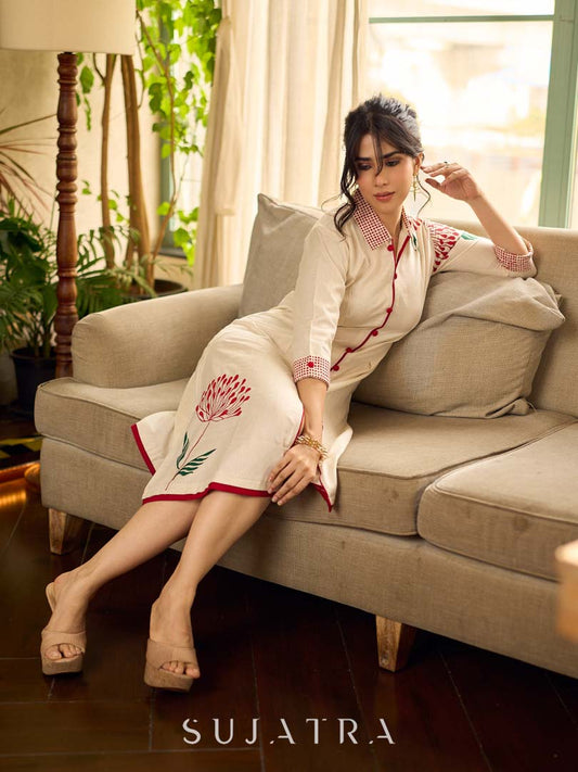 Off-white dandelion pleated shirt dress featuring dandelion placement block prints, checkered block-printed collar and cuffs, and red accents for a fresh, artisanal everyday look.