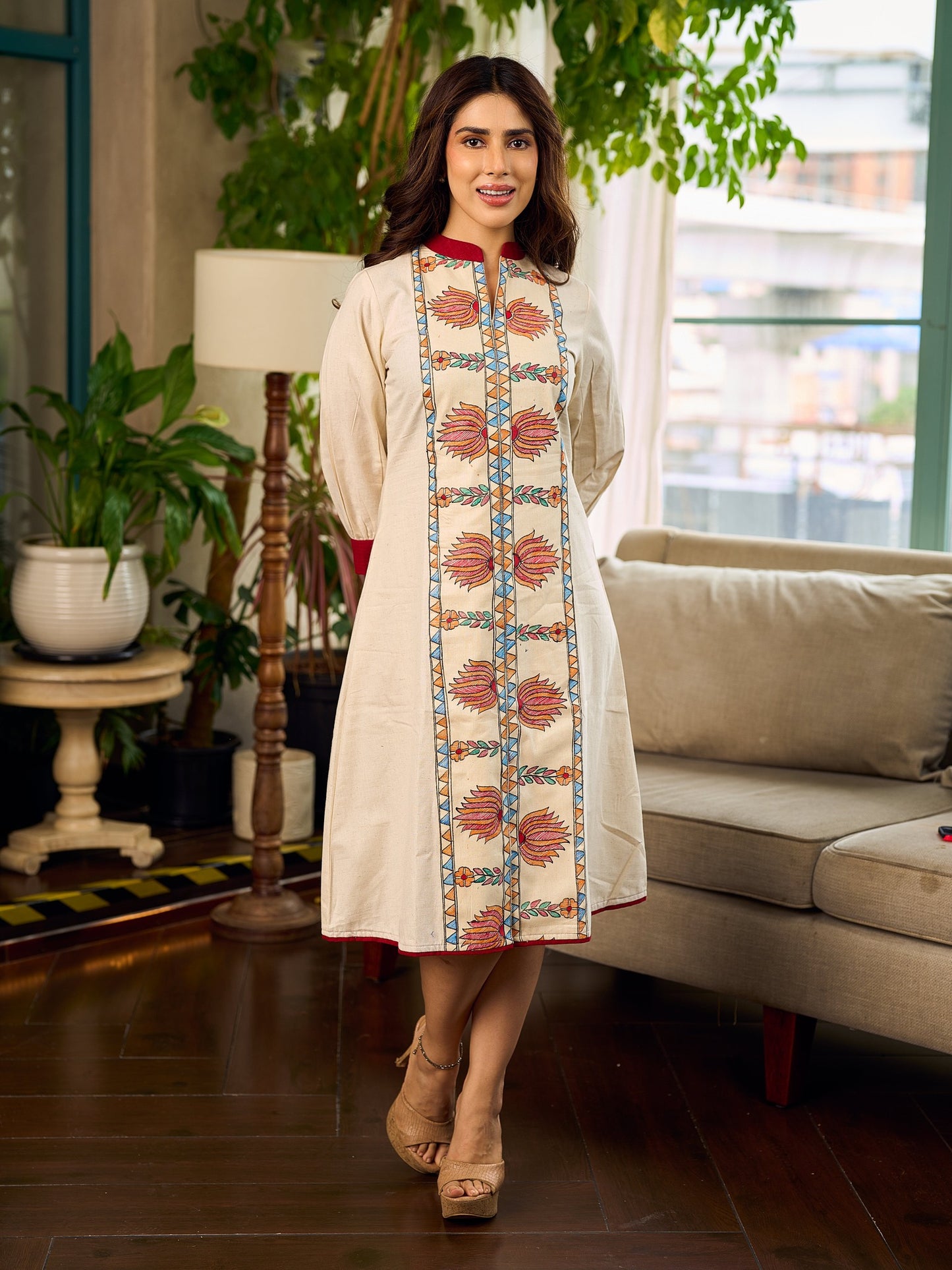 Artisan-crafted off-white Madhubani dress with beautiful hand-painted motifs and trim.