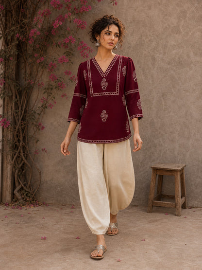 Graceful maroon hand block print top featuring timeless paisley motifs, delicate borders, and an elegant V-neck silhouette, crafted for effortless everyday sophistication.
