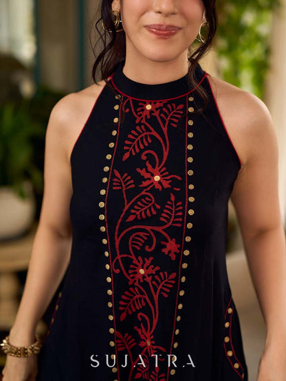 Black bias-cut block print halter dress with a red jaal hand block printed front panel, golden print detailing, and red accents for a striking, elegant statement look.