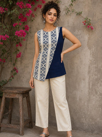 Contemporary off white and navy hand block print top featuring striking geometric motifs, an asymmetric layered silhouette, and effortless elegance
