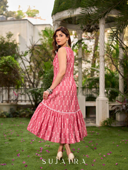Graceful pink Ikat long dress accented in white, designed with gathered detailing at the fall and a clean sleeveless finish