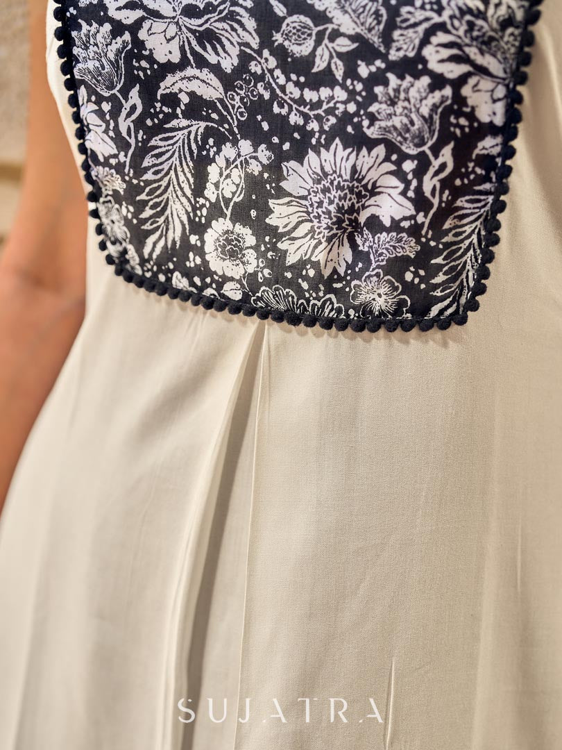 Elegant Off-White Rayon Sleeveless Kurta with Contrast Black Floral Embroidered Yoke Panel