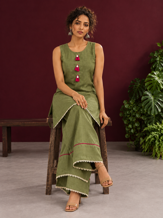 Sage Green Cotton Co-Ord Set with Pink Tassel Shell Buttons and Lace Trim Farshi Salwar — seated