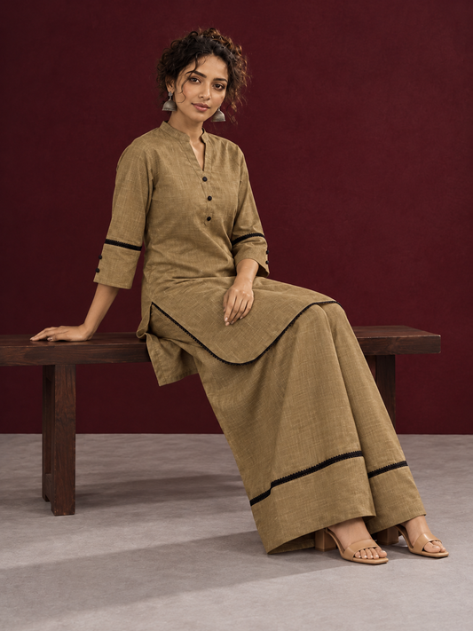 Classic Beige Cotton Co-Ord Set with Mandarin Collar Kurta and Lace Trim Straight Pants — seated
