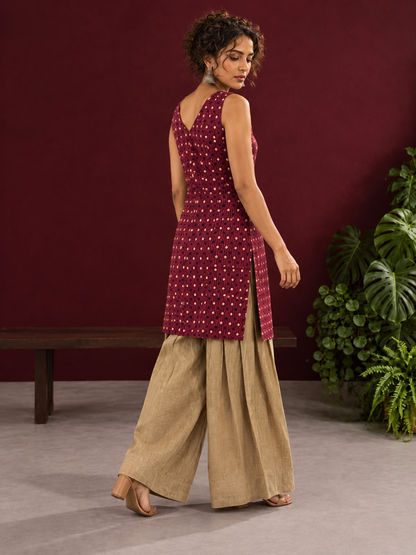 Maroon Printed Cotton Sleeveless Co-Ord Set with Polka Dot Motifs and Pleated Beige Farshi Salwar — in motion