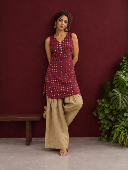 Maroon Printed Cotton Sleeveless Co-Ord Set with Polka Dot Motifs and Pleated Beige Farshi Salwar — side view