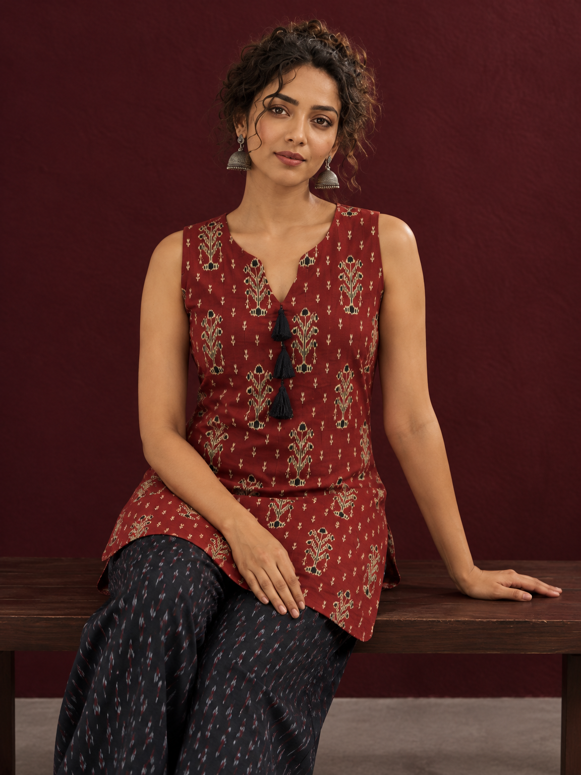Rustic Maroon Cotton Ikat Printed Sleeveless Tunic Co-ord Set with Black Ikat Straight Pant — seated detail — view 7