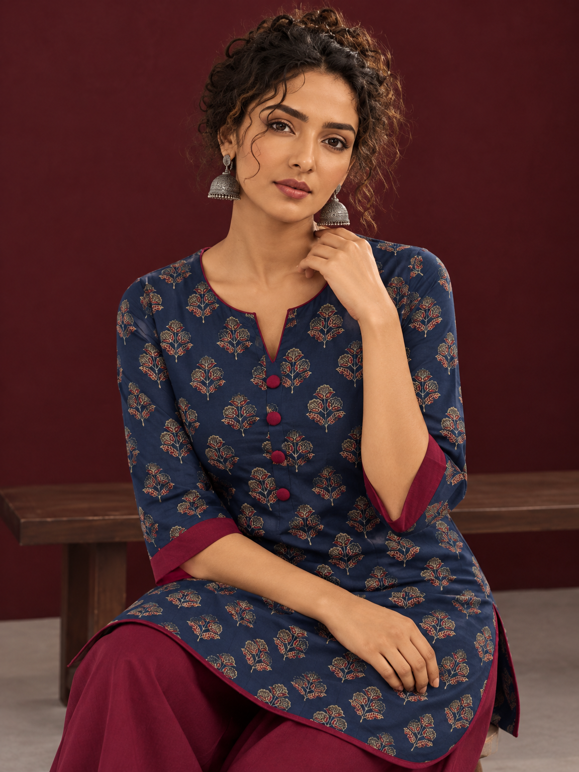 Navy Blue Cotton Kurta with Floral Ajrakh Print & Maroon Contrast Sleeve Cuffs and Maroon Farshi Salwar — seated detail — view 5