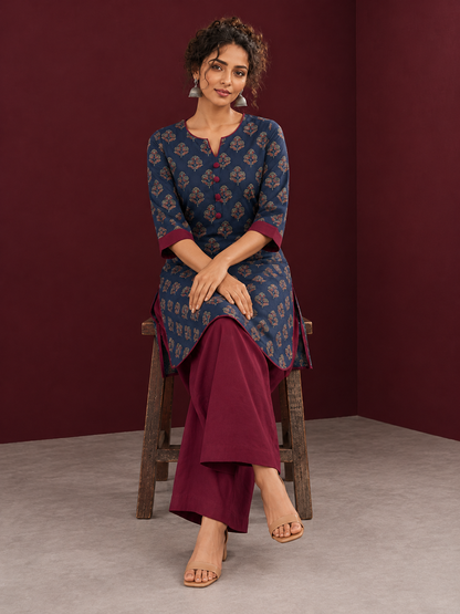 Navy Blue Cotton Kurta with Floral Ajrakh Print & Maroon Contrast Sleeve Cuffs and Maroon Farshi Salwar — seated