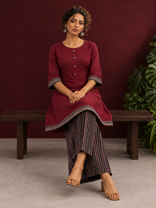 Timeless Maroon Ajrakh Cotton Co-Ord Set with Contrast Printed Border Tunic & Matching Geometric Pattern Farshi Salw — seated