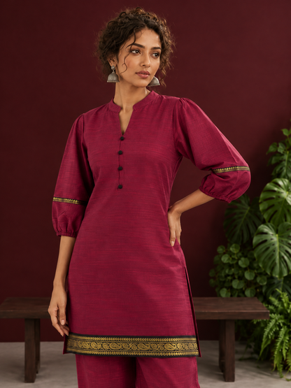 Elegant Maroon Silk Co-Ord Set with Contrast Black & Gold Border Detailing on Hem and Sleeves — fabric detail