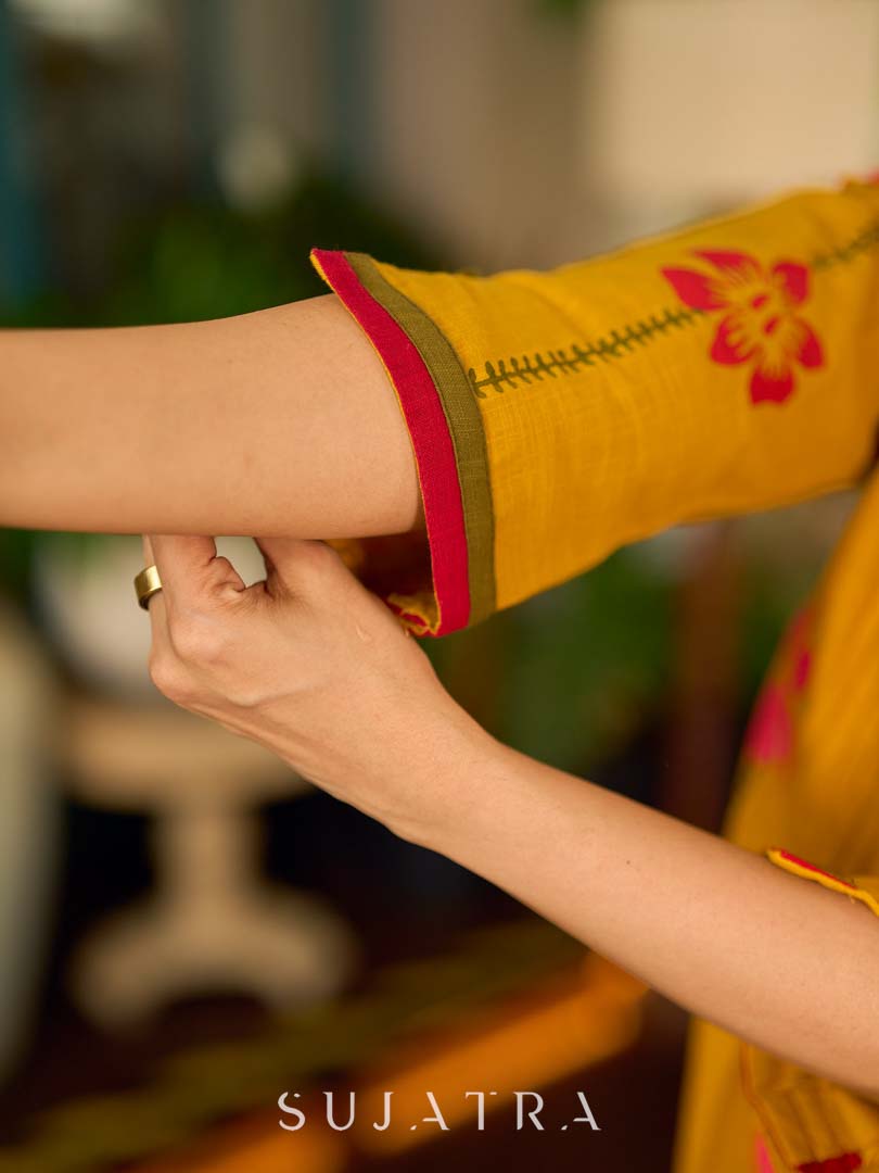 Mustard block printed pintuck dress with hand block red and pink vine floral motifs, accented with red and olive details for a rich, elegant look.