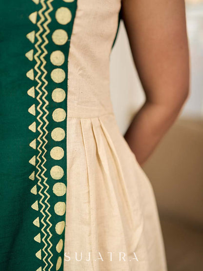 Bottle green and off-white hand block printed sleeveless dress with a block printed geometric panel, pearl embellishments, and refined accents for a contemporary artisanal look.