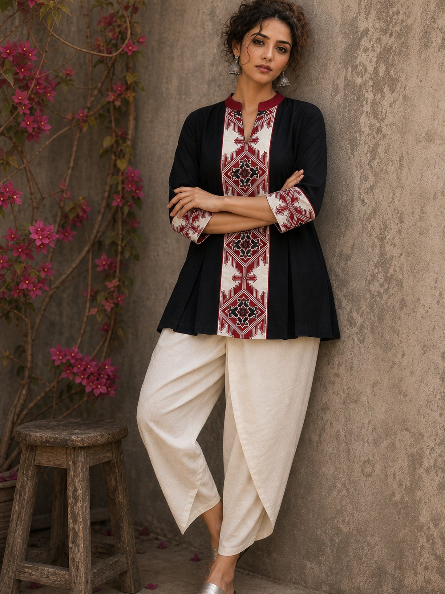 Heritage-inspired black top showcasing handcrafted block print panels, elegant maroon trims, and timeless artistry for versatile modern styling.