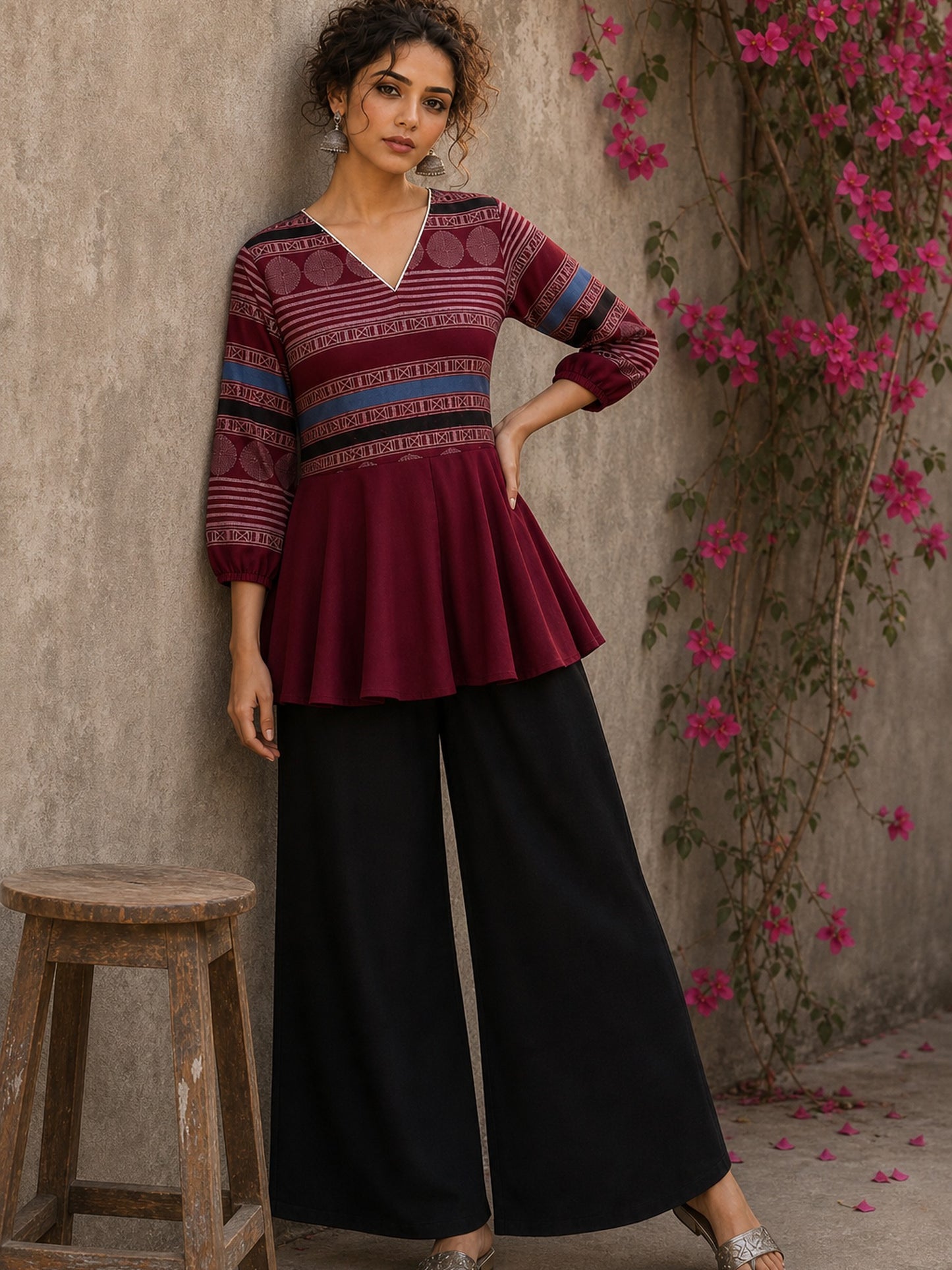 Bold and playful maroon hand block print peplum top with beige geometric motifs and subtle blue accents for effortlessly chic everyday style.
