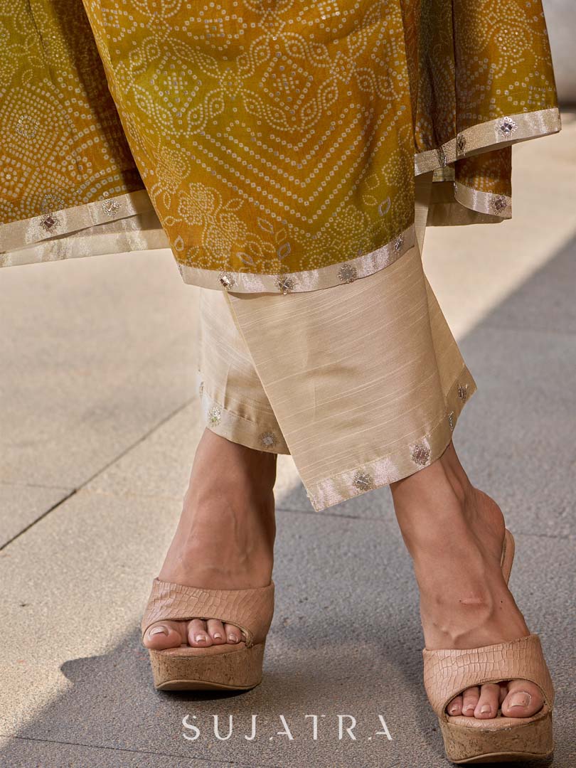 Graceful cream straight pants in cotton-silk, enhanced with subtle embroidered tissue accents.