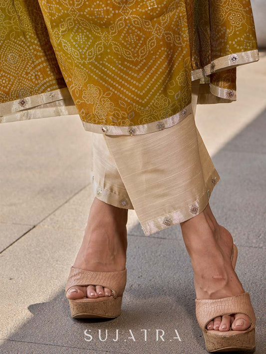 Graceful cream straight pants in cotton-silk, enhanced with subtle embroidered tissue accents.