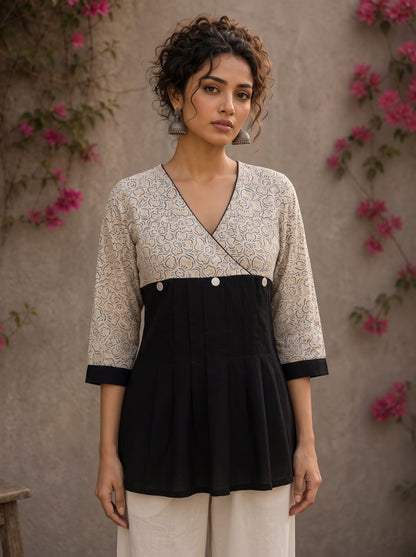 Black Jaipur floral printed yoke top featuring black pintuck body, three-quarter sleeves, and delicate ruffled sleeve edging.