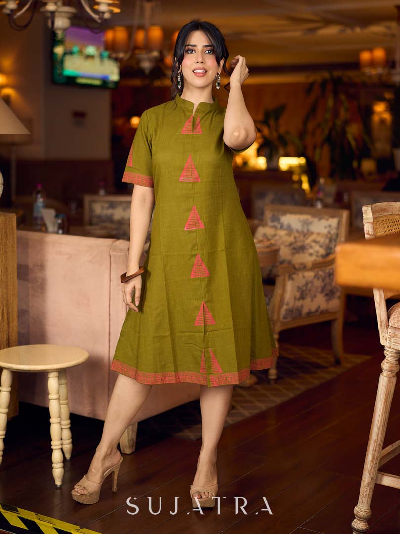 Gorgeous olive dress with pink abstract triangle hand block prints placed at the centre, sleeves, and back, featuring a mandarin collar and half sleeves for a refined, contemporary look.