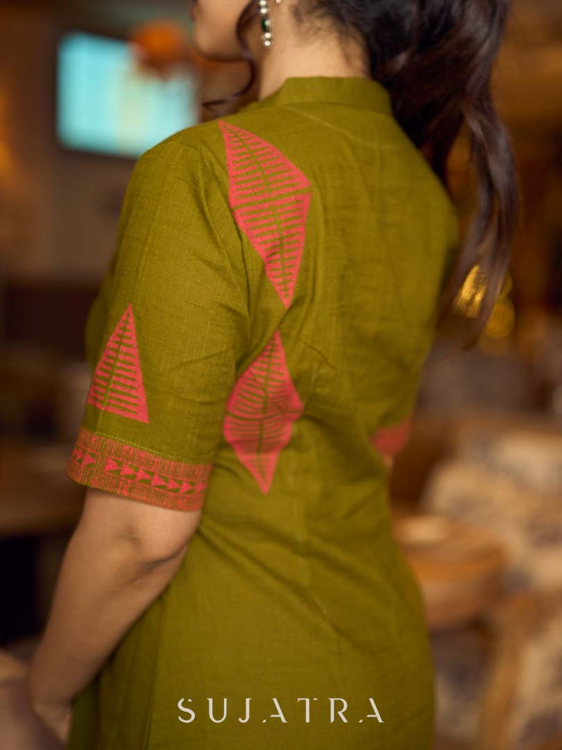 Gorgeous olive dress with pink abstract triangle hand block prints placed at the centre, sleeves, and back, featuring a mandarin collar and half sleeves for a refined, contemporary look.