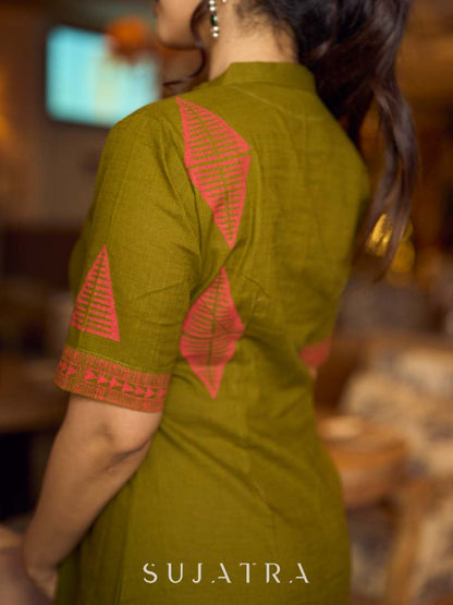 Gorgeous olive dress with pink abstract triangle hand block prints placed at the centre, sleeves, and back, featuring a mandarin collar and half sleeves for a refined, contemporary look.