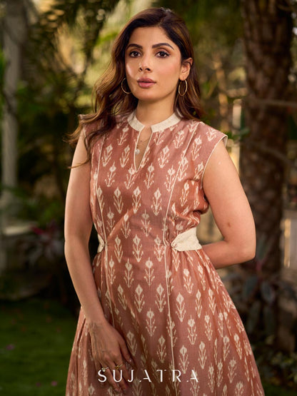 Chic champagne beige Ikat dress elevated with Hakoba accents, a relaxed drop-shoulder fit, mandarin neckline, and fluid side gathers detailed with Hakoba flaps.