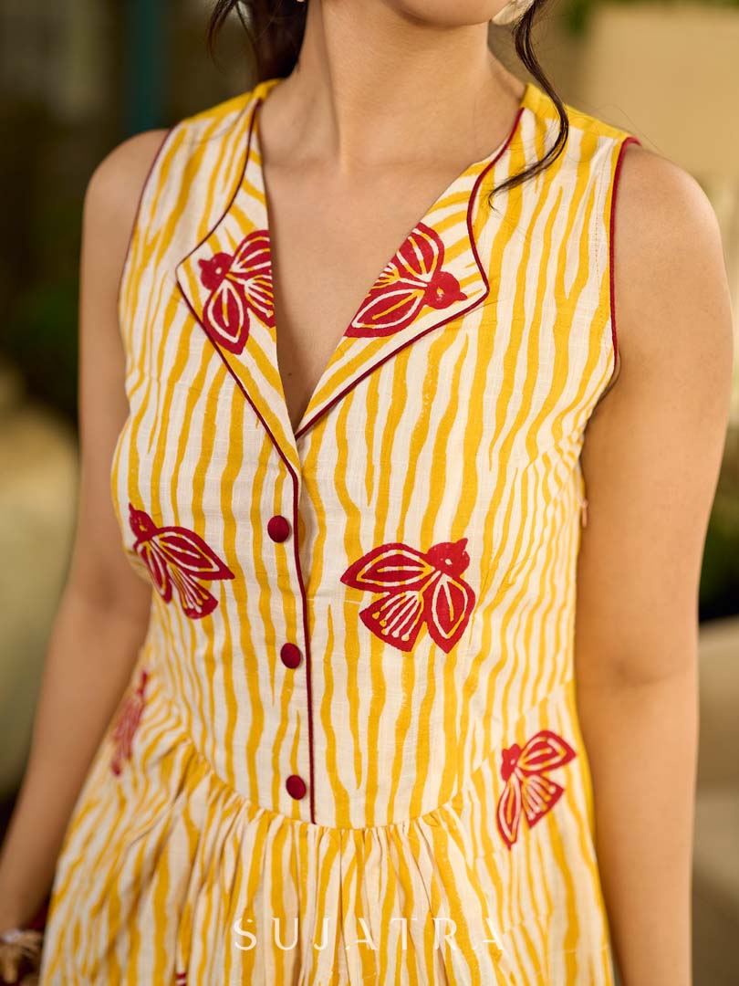 Yellow and white zebra-striped hand block printed sleeveless vintage luxe dress with maroon bird motifs and matching accents for a bold, elegant statement look.